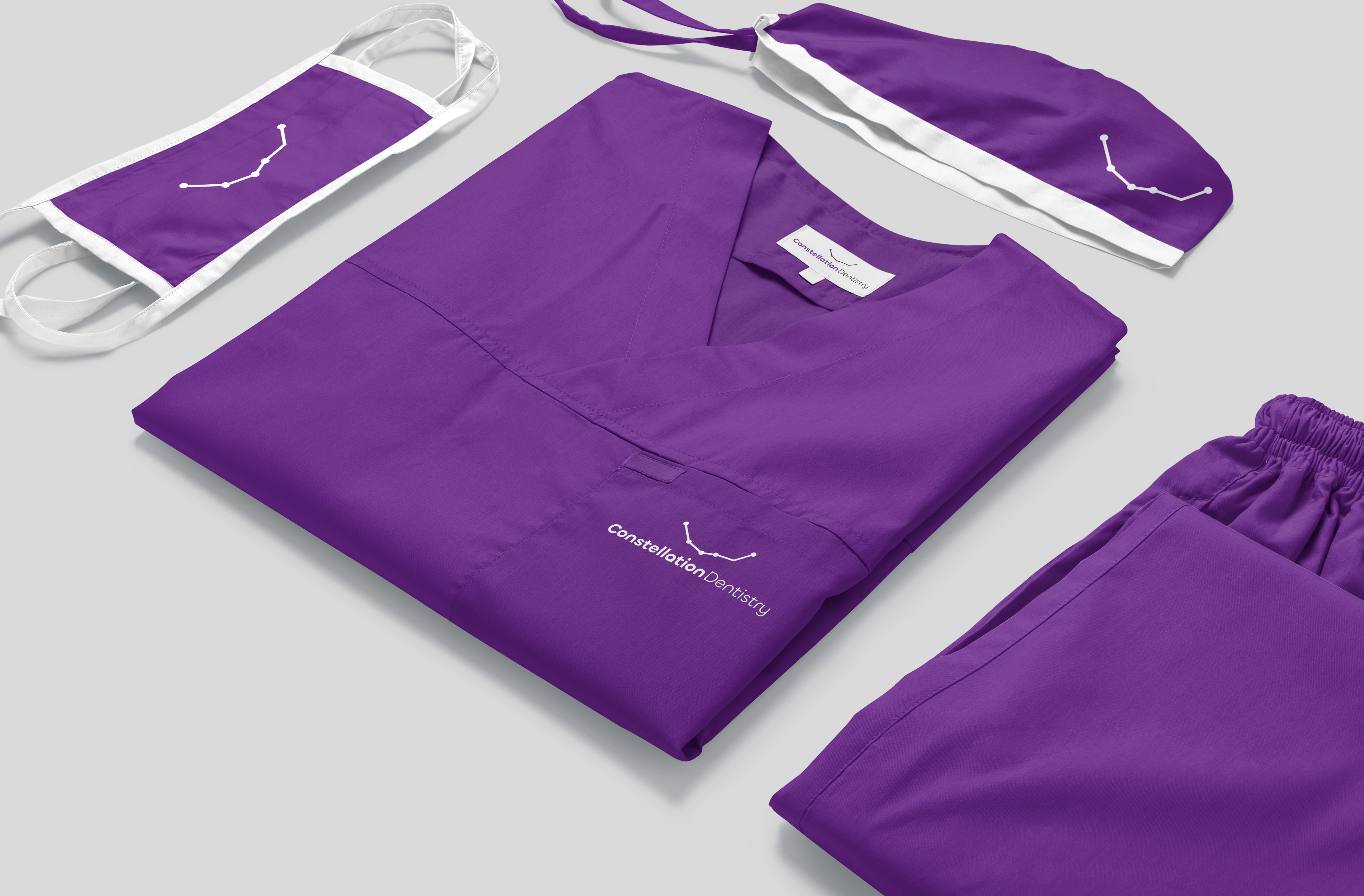 Purple medical scrubs with constellation Dentistry logo embroided