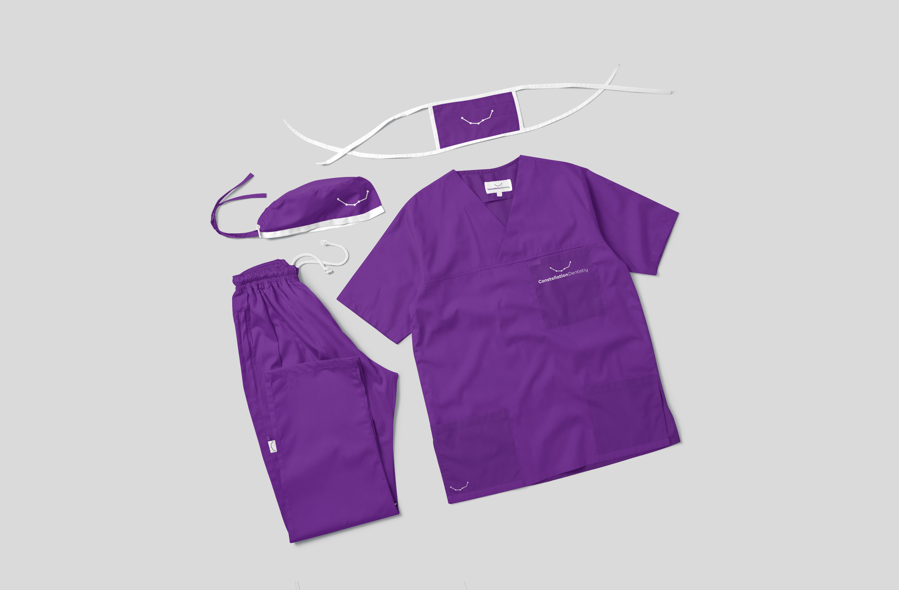 Purple medical scrubs with constellation Dentistry logo embroided