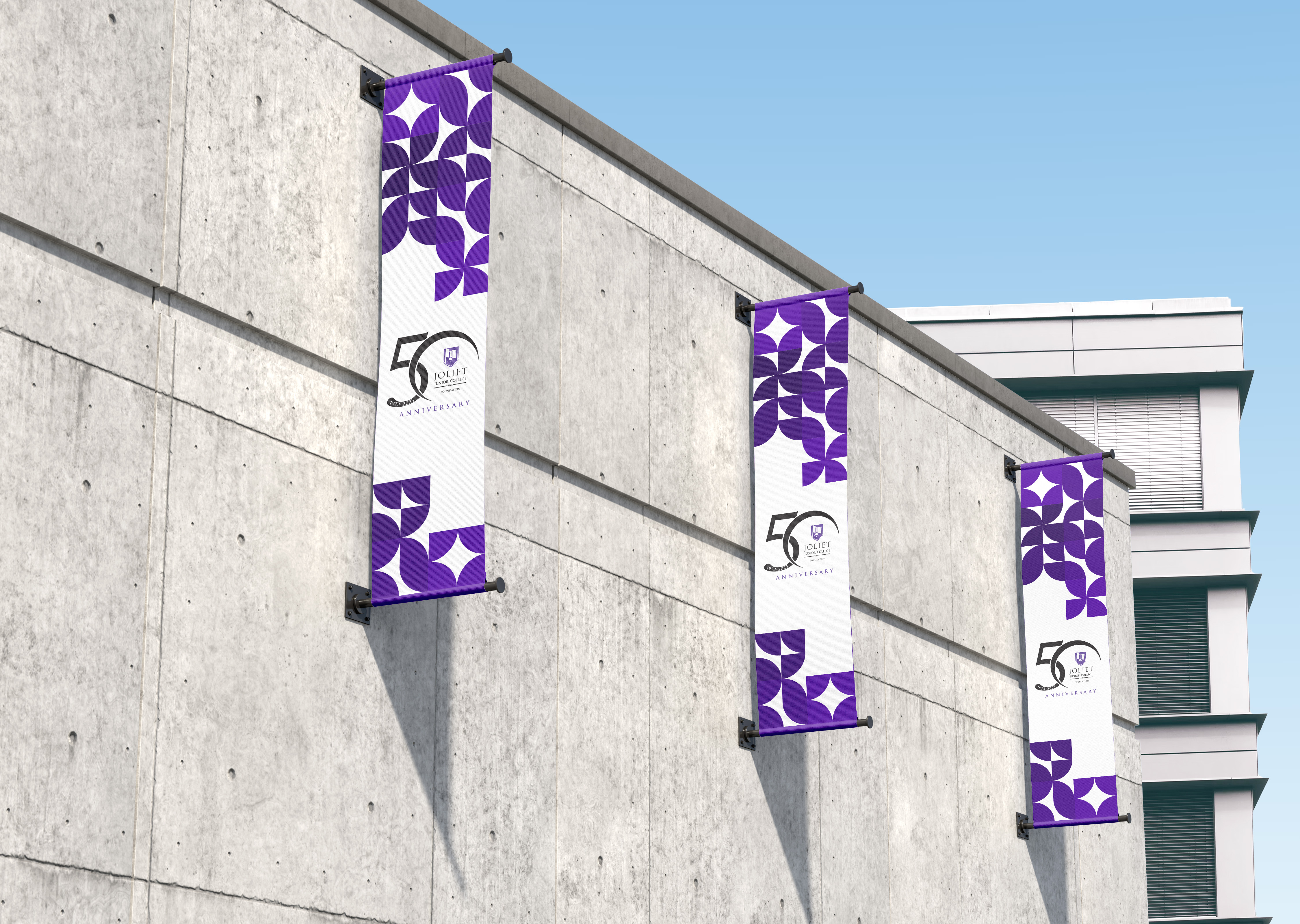 Side of building with multiple banners featuring branding for Joliet Junior College Foundation 50th Gala